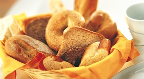 Bread basket with bread and biscuit.