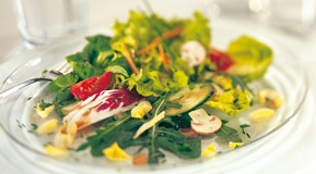 Mixed Salad on a table, Close up.